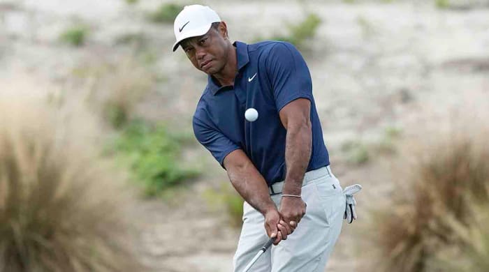 Tiger Woods watches his shot during a practice round for the Hero World Challenge at the Albany Golf Club, in New Providence, Bahamas, Wednesday, Nov. 29, 2023.